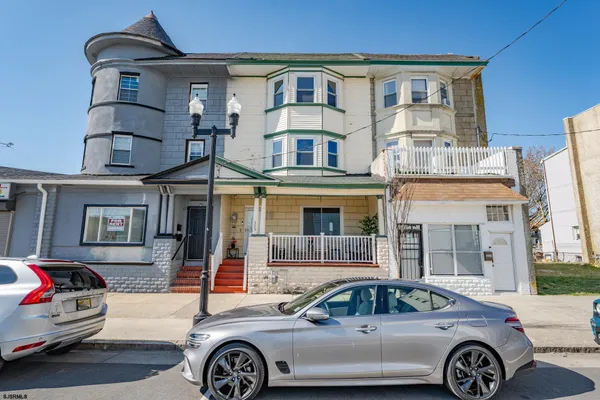 a front view of a house with parking space