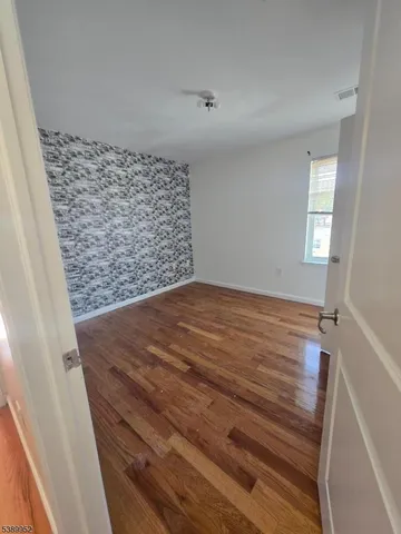 a kitchen with a refrigerator and a sink