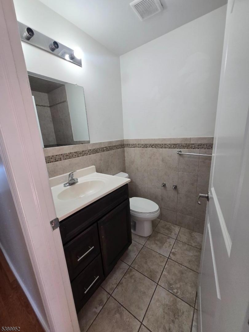 452 Fulton Street, Unit 1 Elizabeth Port, NJ 07206 - Photo 8 of 11 a bathroom with a sink and a mirror