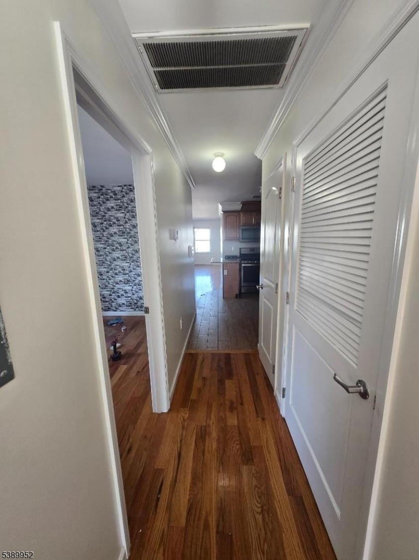 452 Fulton Street, Unit 1 Elizabeth Port, NJ 07206 - Photo 9 of 11 a view of entryway with wooden floor