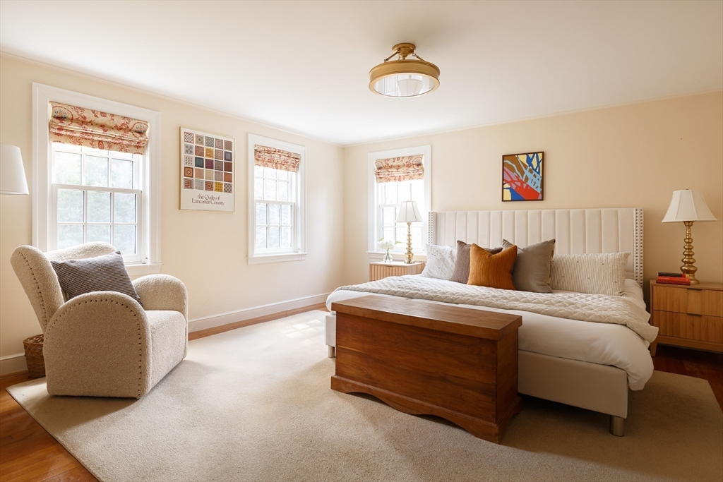 170 Reservoir Road Brookline, MA 02467 - Photo 12 of 20 a bedroom with bed a couch and a window