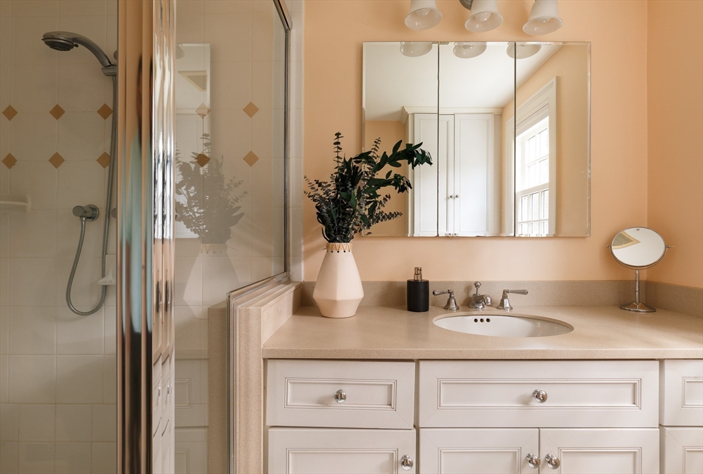 170 Reservoir Road Brookline, MA 02467 - Photo 13 of 20 a bathroom with a sink vanity granite and a mirror