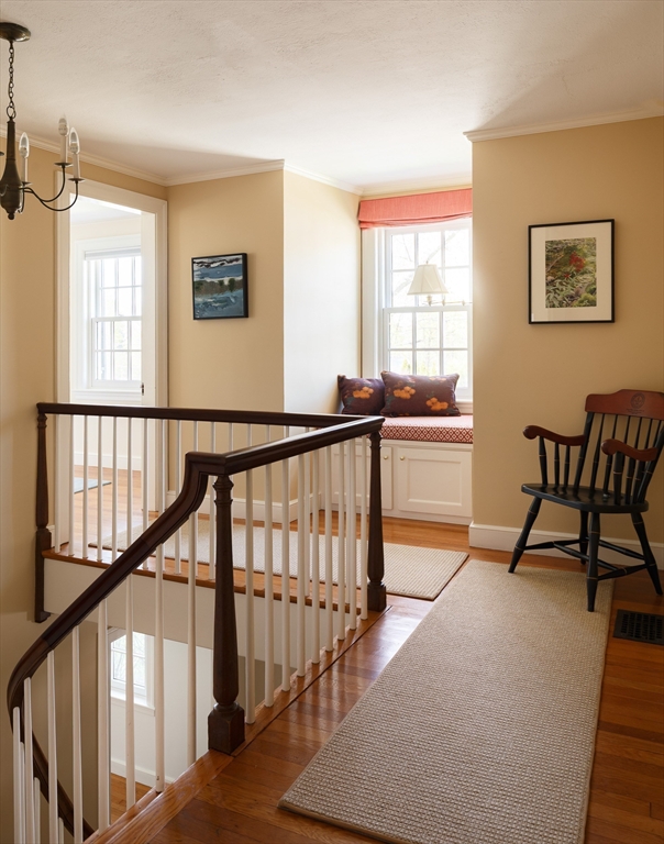 170 Reservoir Road Brookline, MA 02467 - Photo 14 of 20 a view of staircase with furniture and a window