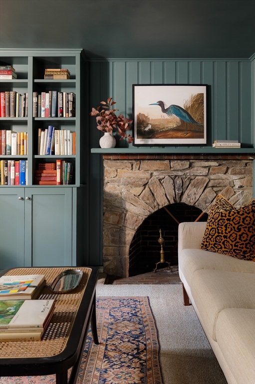 170 Reservoir Road Brookline, MA 02467 - Photo 18 of 20 a living room with furniture and a fireplace