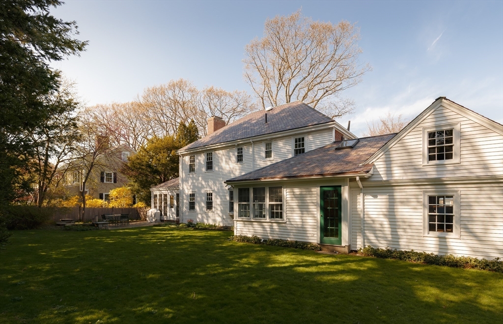 170 Reservoir Road Brookline, MA 02467 - Photo 2 of 20 a front view of a house with a garden