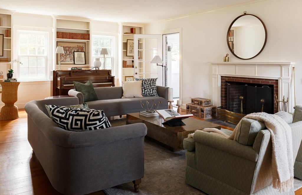170 Reservoir Road Brookline, MA 02467 - Photo 5 of 20 a living room with fireplace furniture and a large window