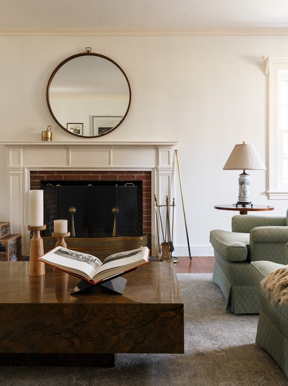 170 Reservoir Road Brookline, MA 02467 - Photo 6 of 20 a living room with furniture and a fireplace