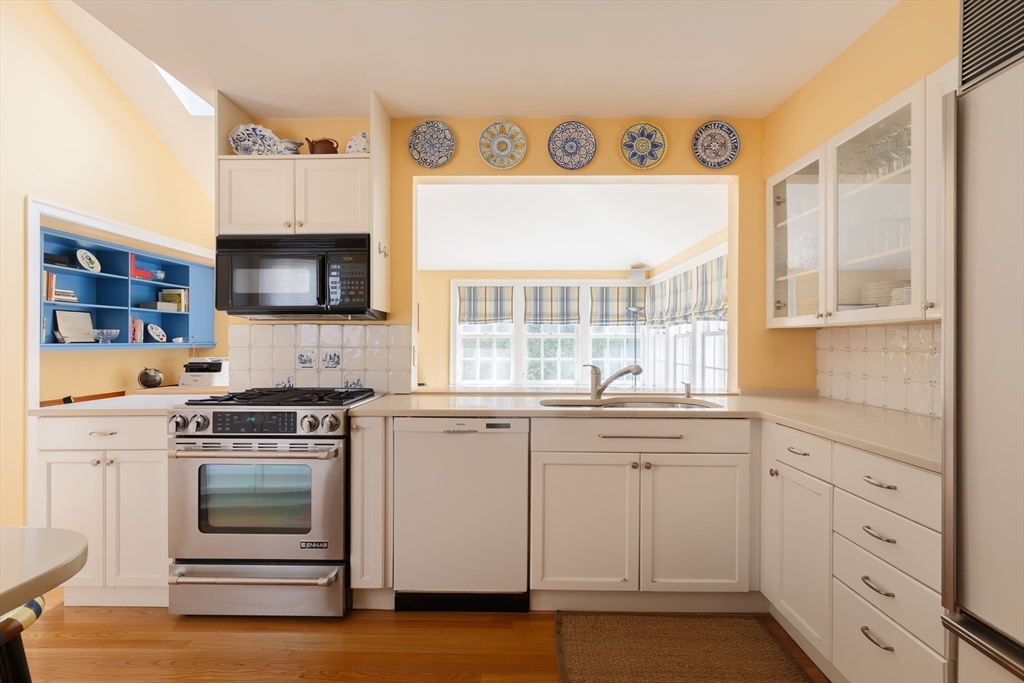 170 Reservoir Road Brookline, MA 02467 - Photo 7 of 20 a kitchen with stainless steel appliances granite countertop a stove and a sink