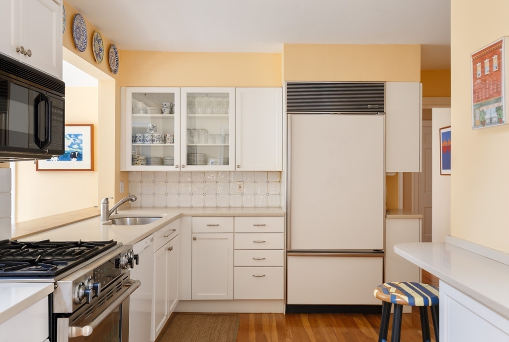 170 Reservoir Road Brookline, MA 02467 - Photo 8 of 20 a kitchen with a sink stove and refrigerator