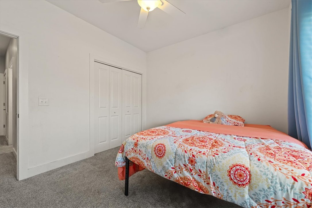 212 Winding Lane Seneca, SC 29672 - Photo 22 of 48 This cozy bedroom features comfortable carpeting and a convenient closet for easy storage.