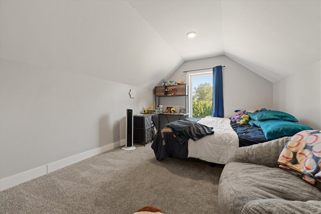 212 Winding Lane Seneca, SC 29672 - Photo 27 of 48 This cozy bedroom features a bright window and soft carpet, creating a comfortable living space.