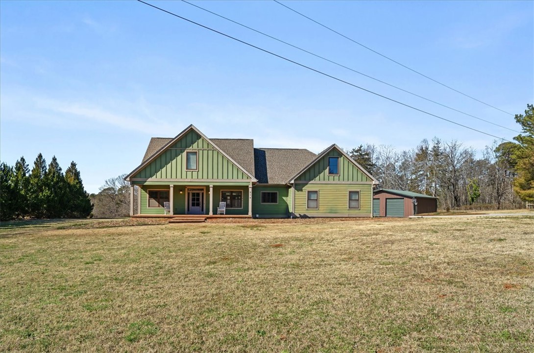 212 Winding Lane Seneca, SC 29672 - Photo 3 of 48 This charming home offers expansive outdoor space and a welcoming porch for tranquil living.