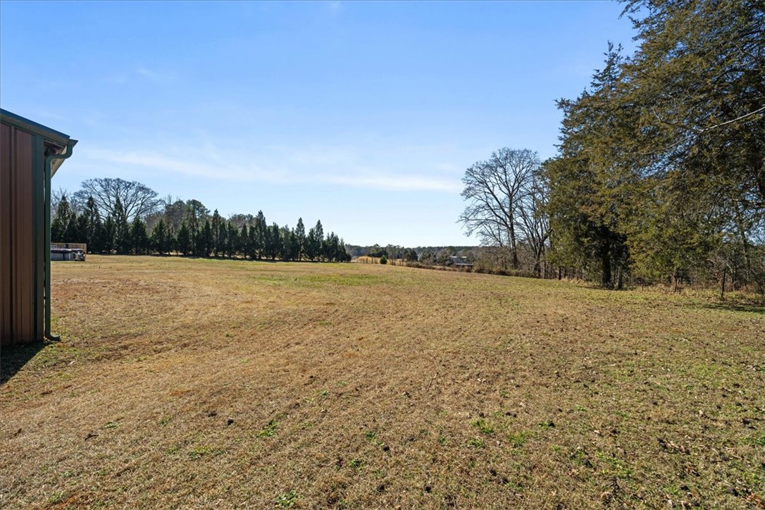 212 Winding Lane Seneca, SC 29672 - Photo 39 of 48 Expansive open field offers abundant space and natural beauty for various possibilities.