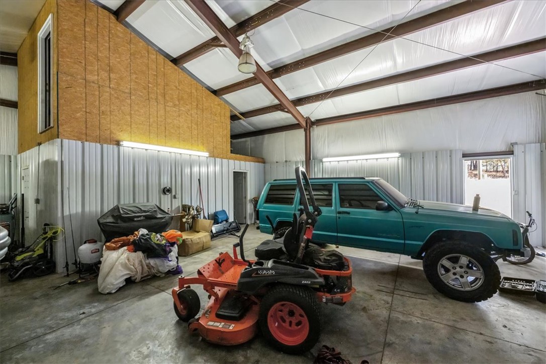 212 Winding Lane Seneca, SC 29672 - Photo 44 of 48 This spacious garage offers ample storage and a robust concrete floor for all your needs.