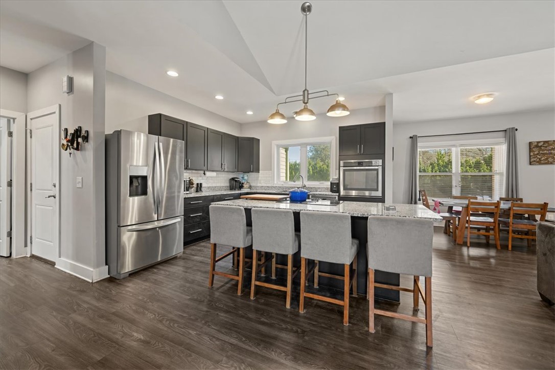 212 Winding Lane Seneca, SC 29672 - Photo 7 of 48 This open concept kitchen offers functional design and modern appeal.
