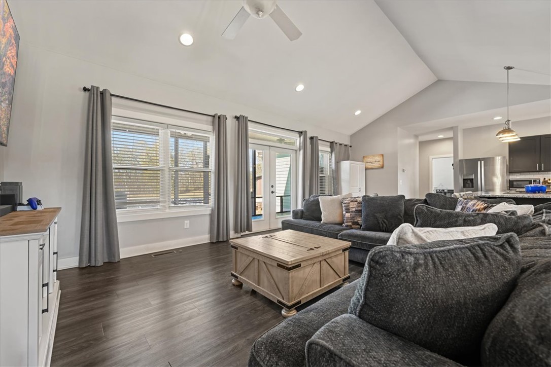 212 Winding Lane Seneca, SC 29672 - Photo 9 of 48 This inviting living area features vaulted ceilings and ample natural light, perfect for gatherings.