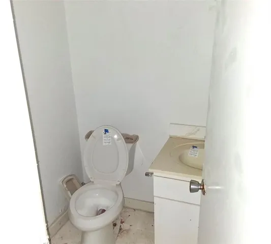 a bathroom with a toilet and a sink
