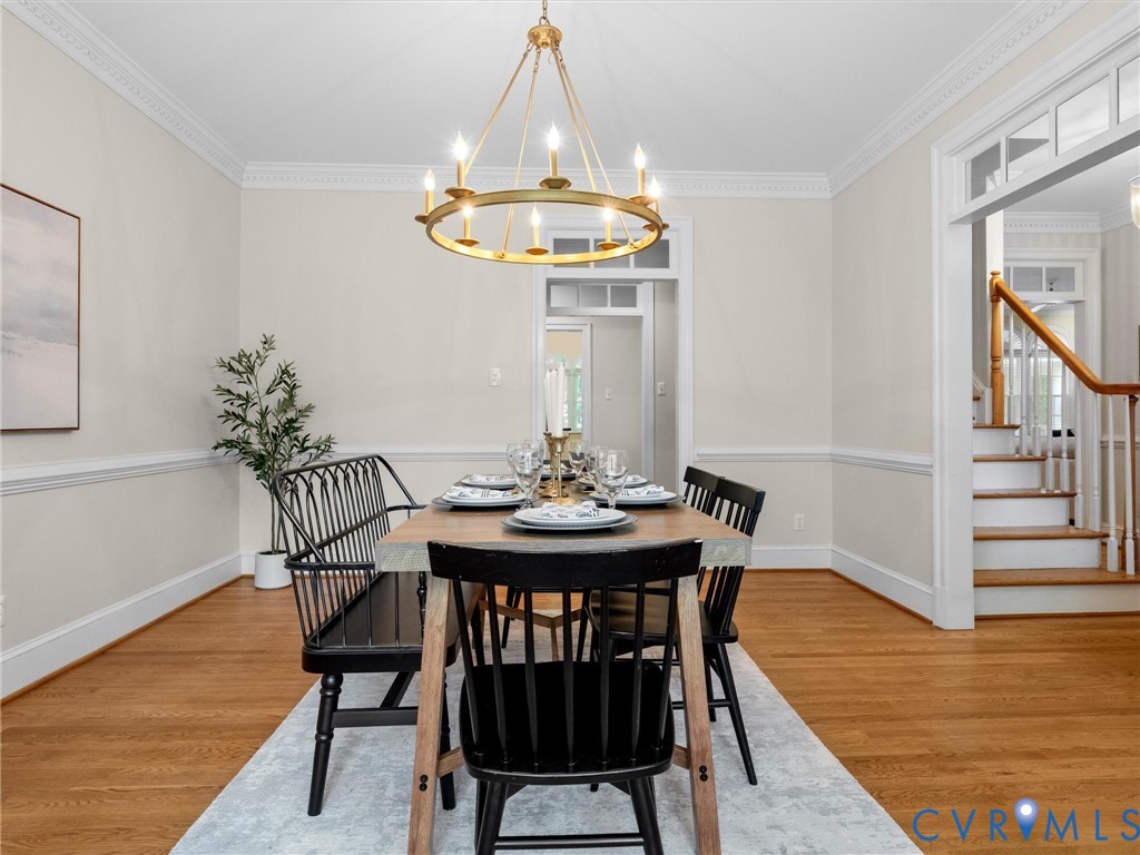2011 Gamelaw Court Midlothian, VA 23113 - Photo 14 of 77 a view of a dining room with furniture and wooden floor
