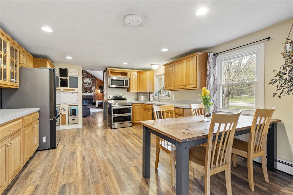 101 Williams Road Ashburnham, MA 01430 - Photo 21 of 42 a kitchen with stainless steel appliances granite countertop table chairs refrigerator and sink