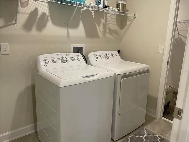 a utility room with dryer and washer