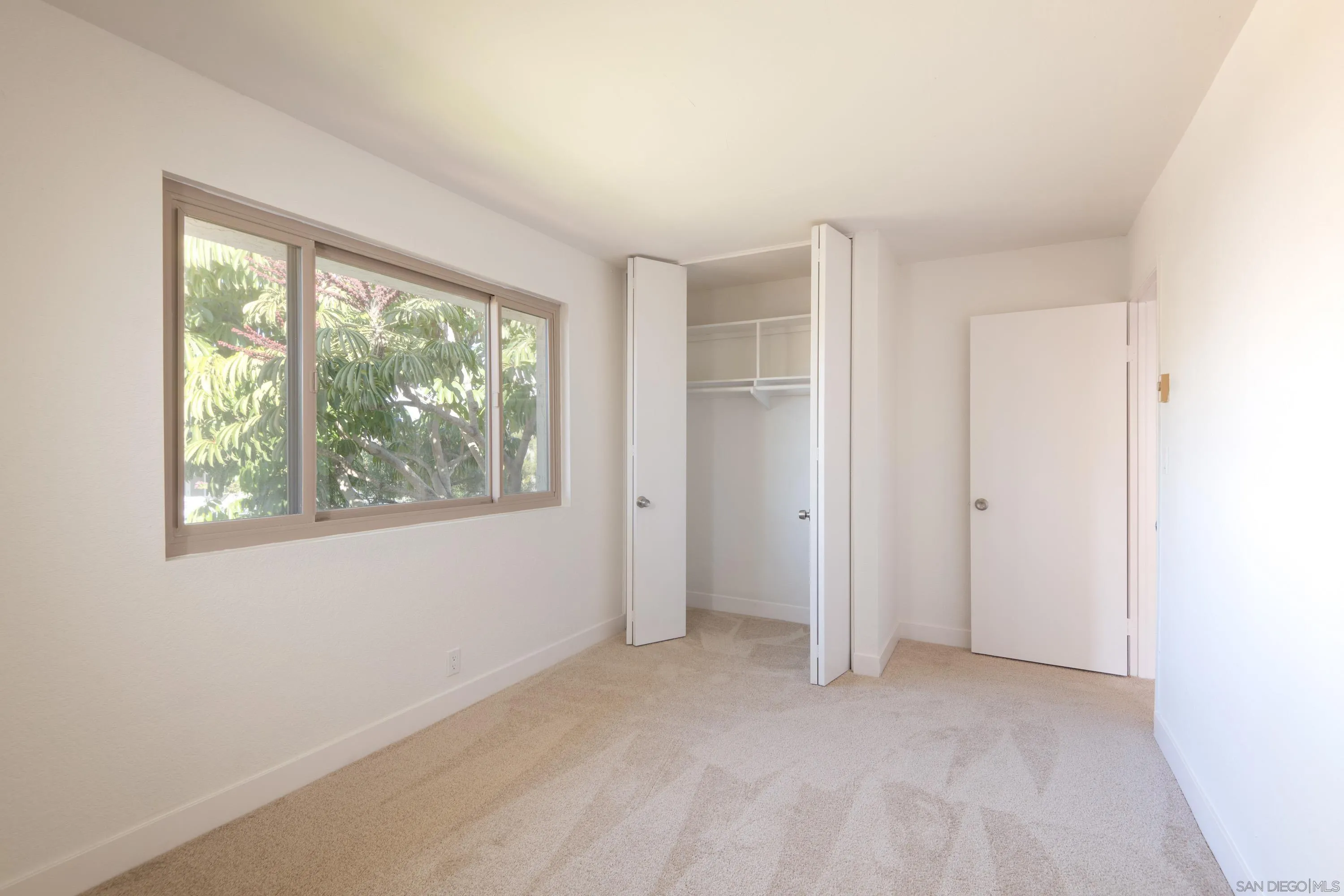441 D Avenue Coronado, CA 92118 - Photo 12 of 24 a view of an empty room with a window