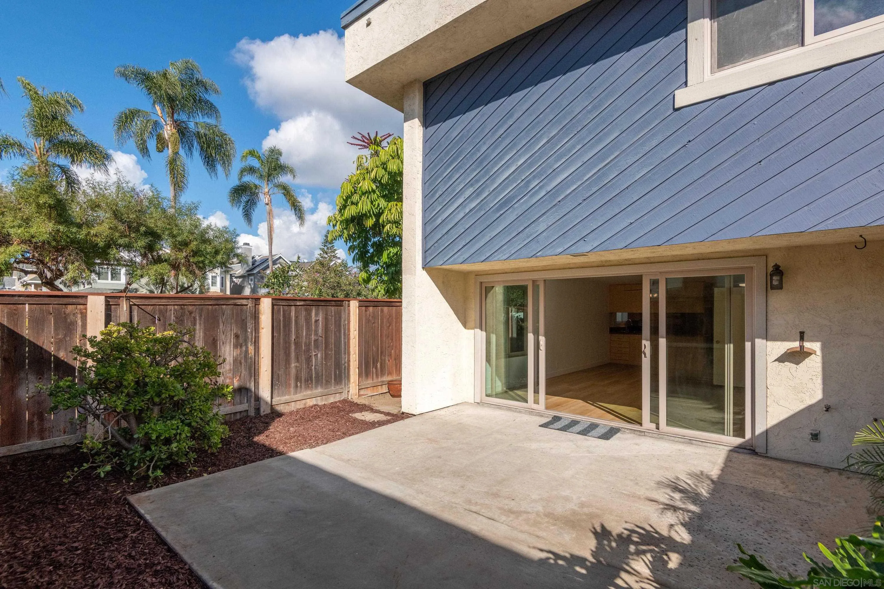 441 D Avenue Coronado, CA 92118 - Photo 18 of 24 a house with a yard and potted plants