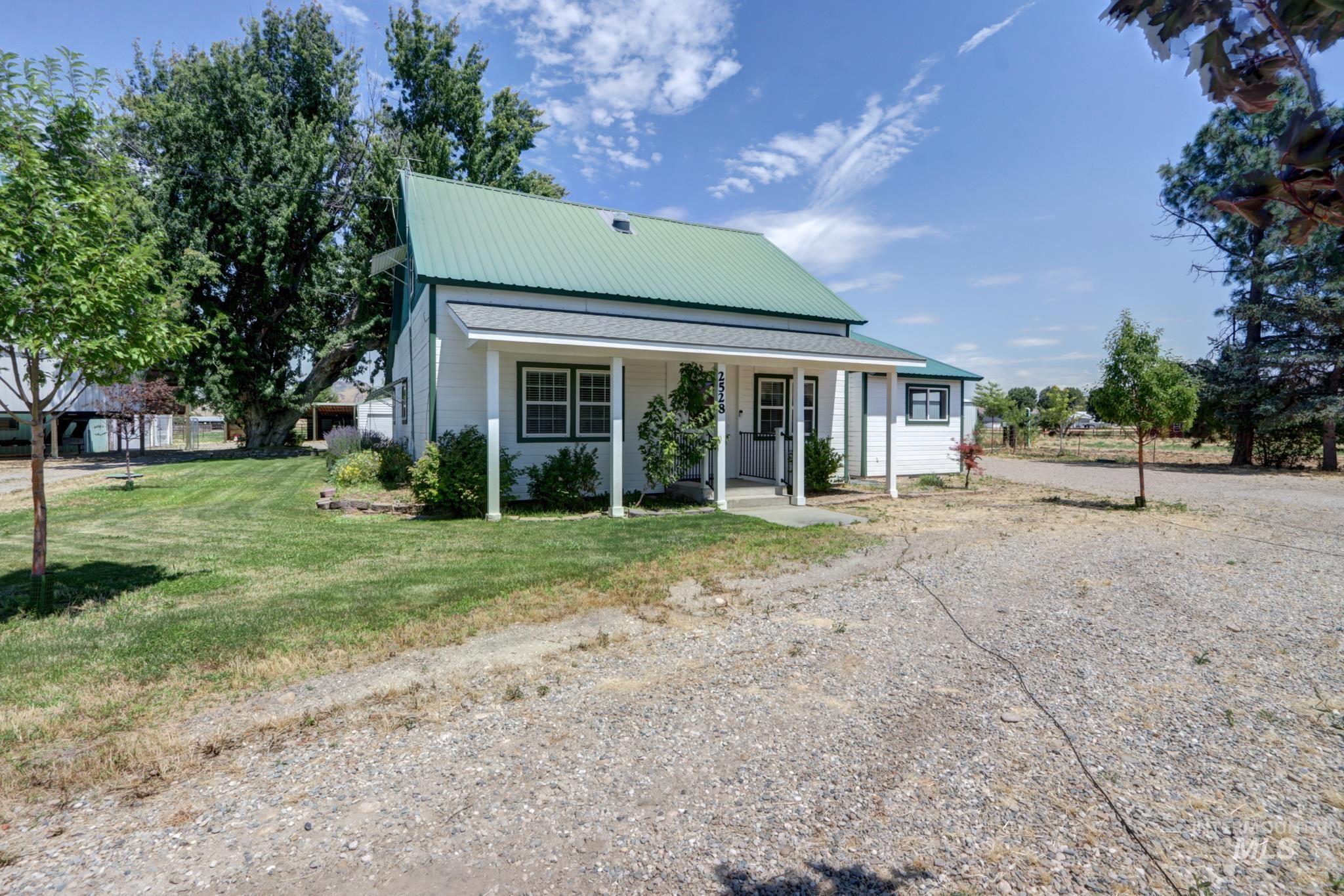 2528 Waterwheel Road Emmett, ID 83617 - Photo 12 of 50 Open-concept living space with wood-finish flooring