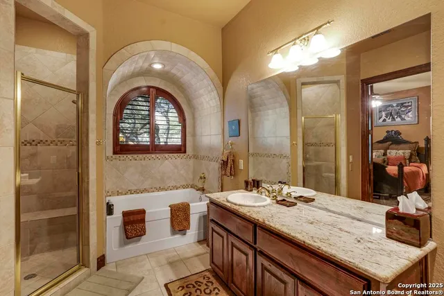 a bathroom with a granite countertop sink a mirror and a vanity