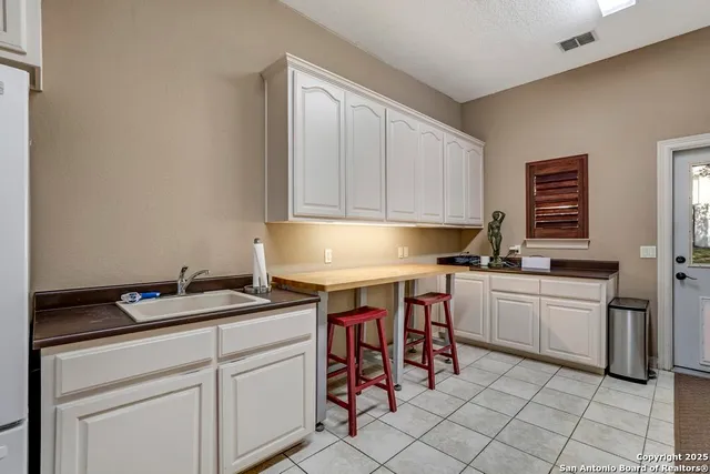 front view of a house with a swimming pool