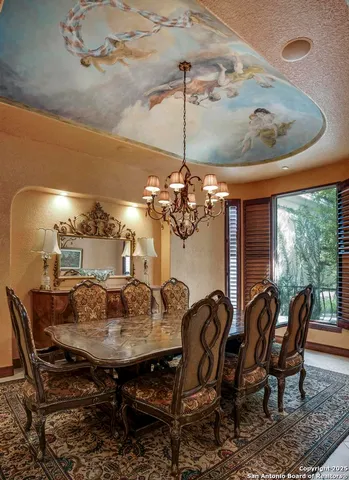 a view of a dining room with furniture and window