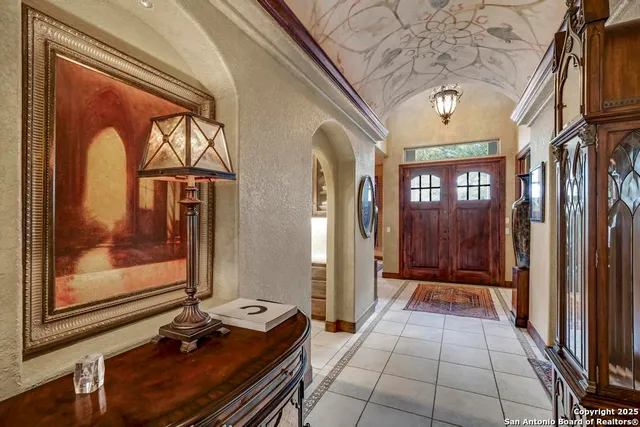 a living room with furniture a fireplace and flat screen tv