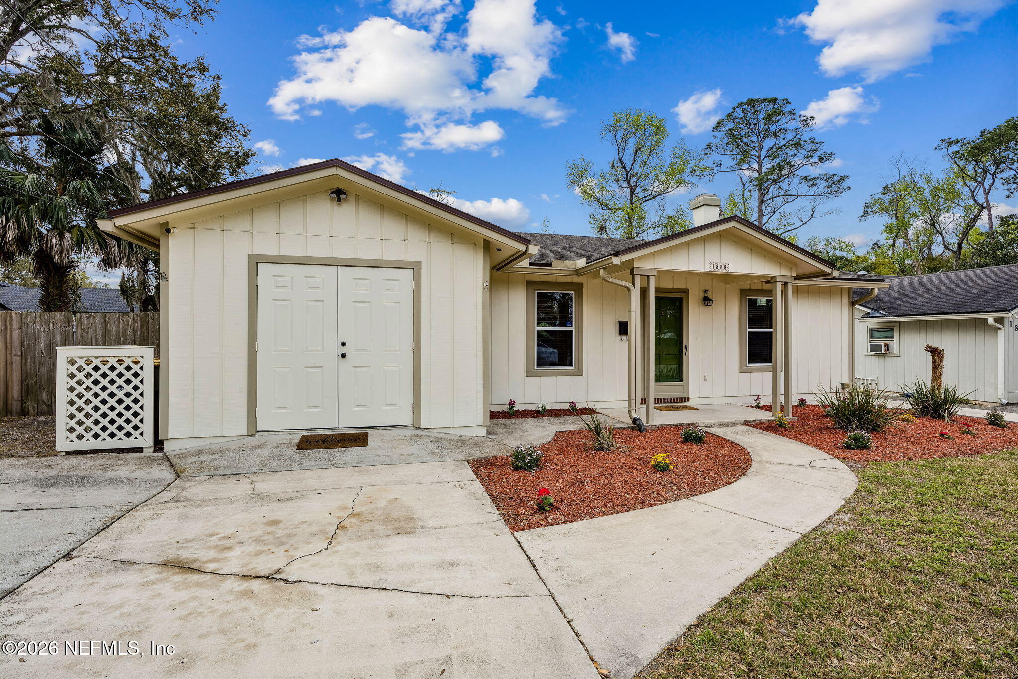 1888 Clemson Road Jacksonville, FL 32217 - Photo 36 of 41 a front view of a house with a garden