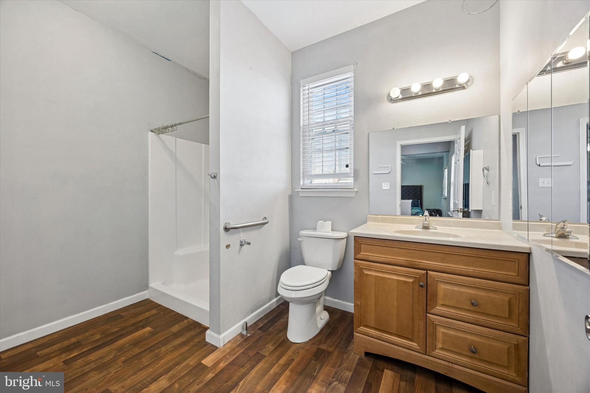 12 George Street Mount Ephraim, NJ 08059 - Photo 19 of 33 a bathroom with a sink a toilet a mirror and shower