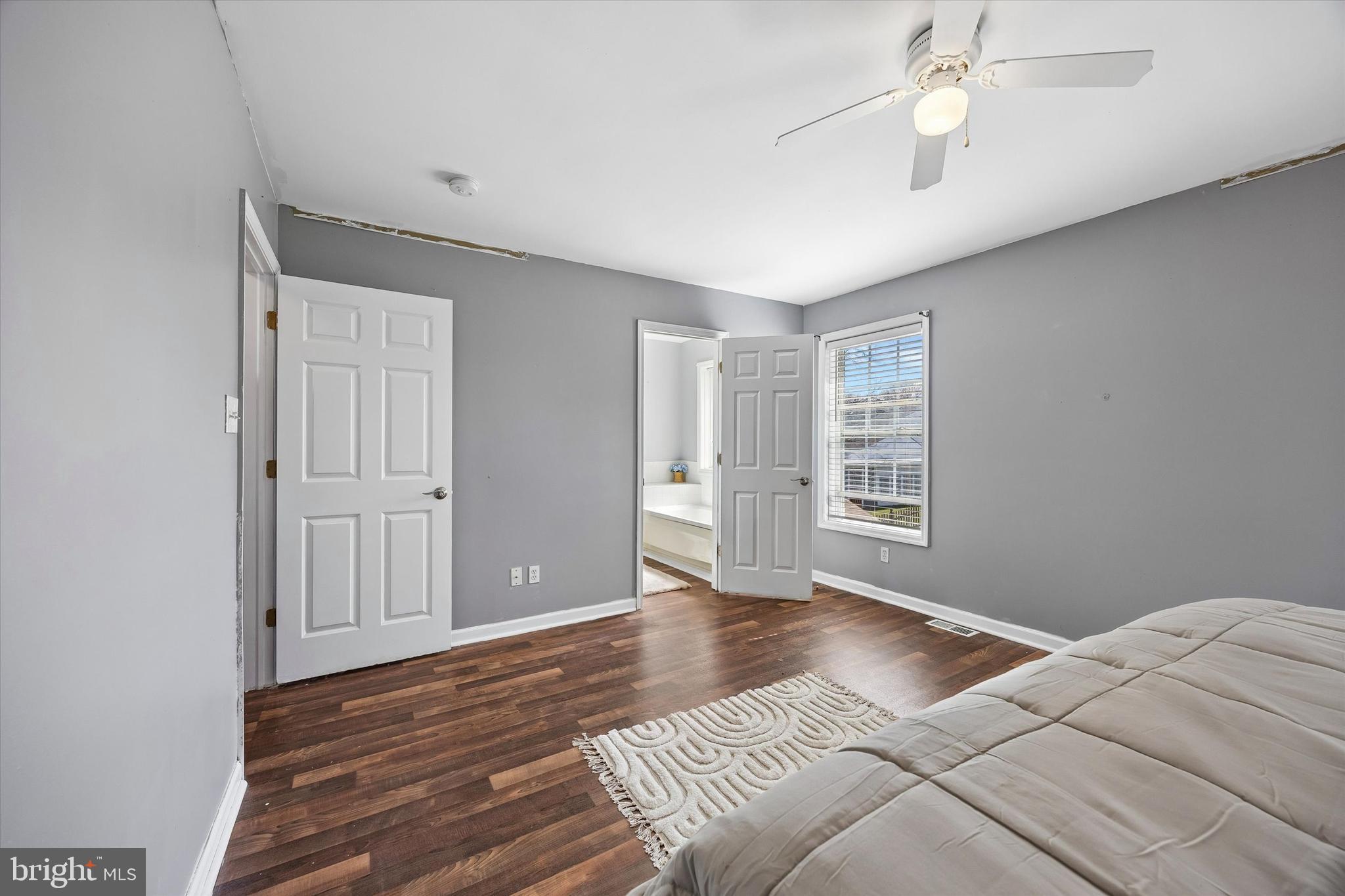 12 George Street Mount Ephraim, NJ 08059 - Photo 23 of 33 a view of a bedroom with wooden floor and window