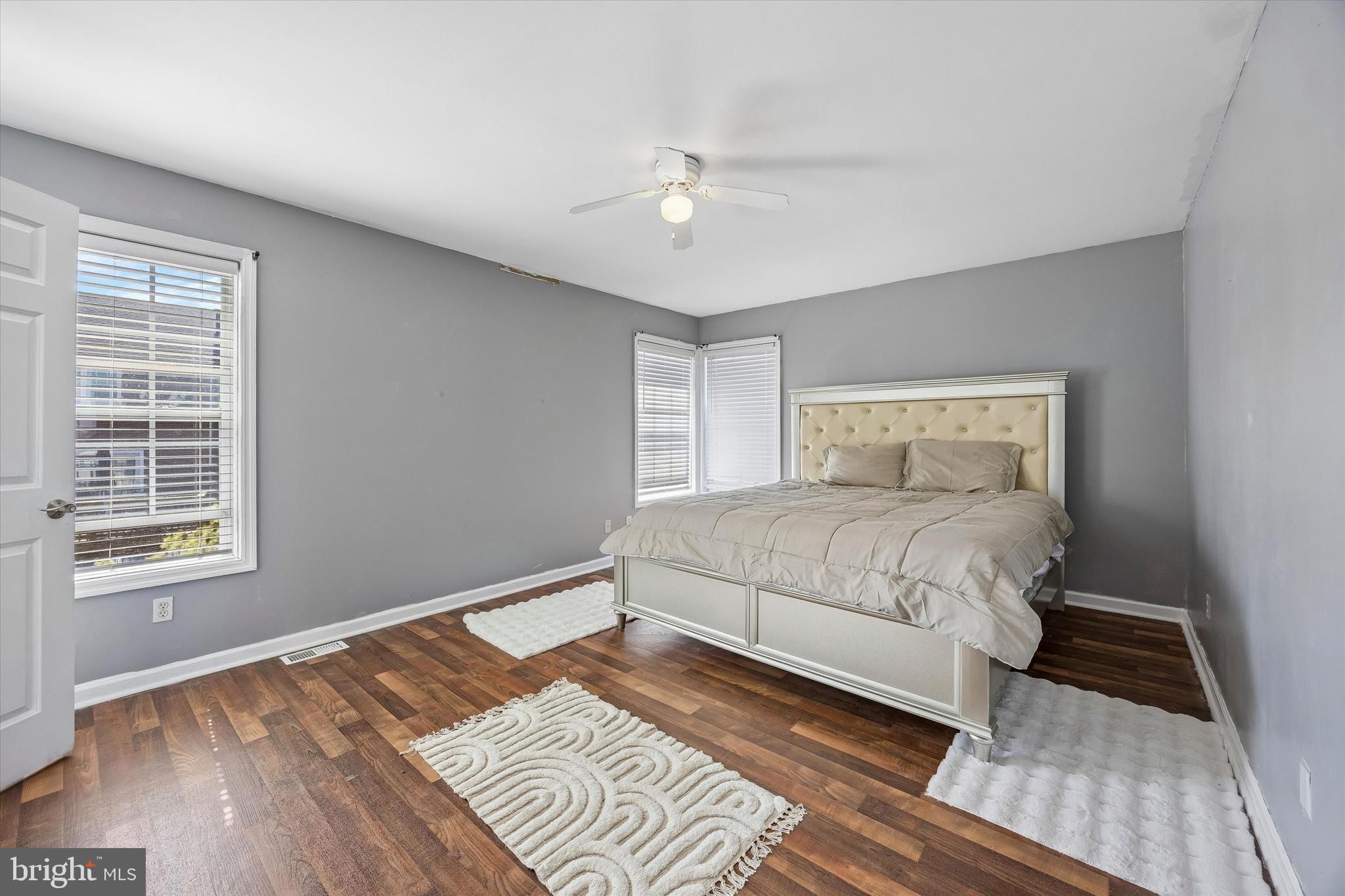 12 George Street Mount Ephraim, NJ 08059 - Photo 24 of 33 a bedroom with a large bed chandelier and a window