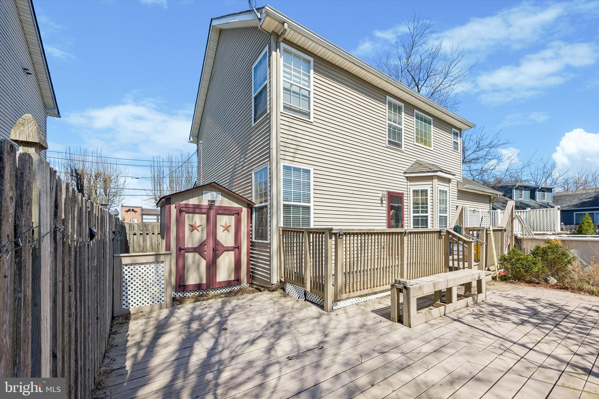12 George Street Mount Ephraim, NJ 08059 - Photo 32 of 33 a view of a white house with a large windows and wooden fence