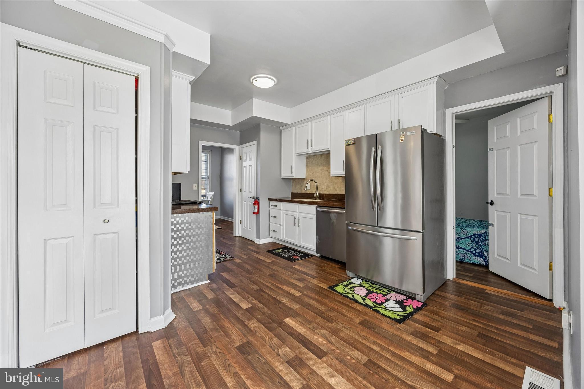 12 George Street Mount Ephraim, NJ 08059 - Photo 10 of 33 a kitchen with a refrigerator and wooden floor