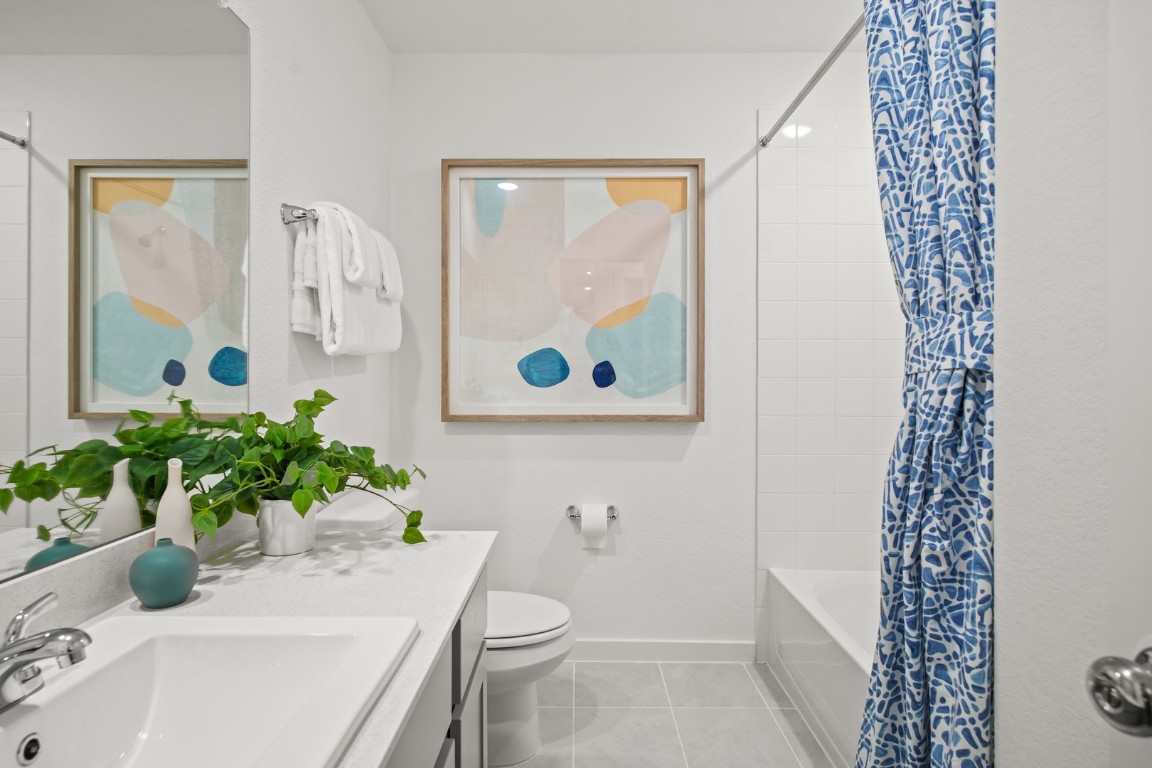 439 Lucky Avenue Elgin, TX 78621 - Photo 26 of 38 a bathroom with a sink toilet and shower