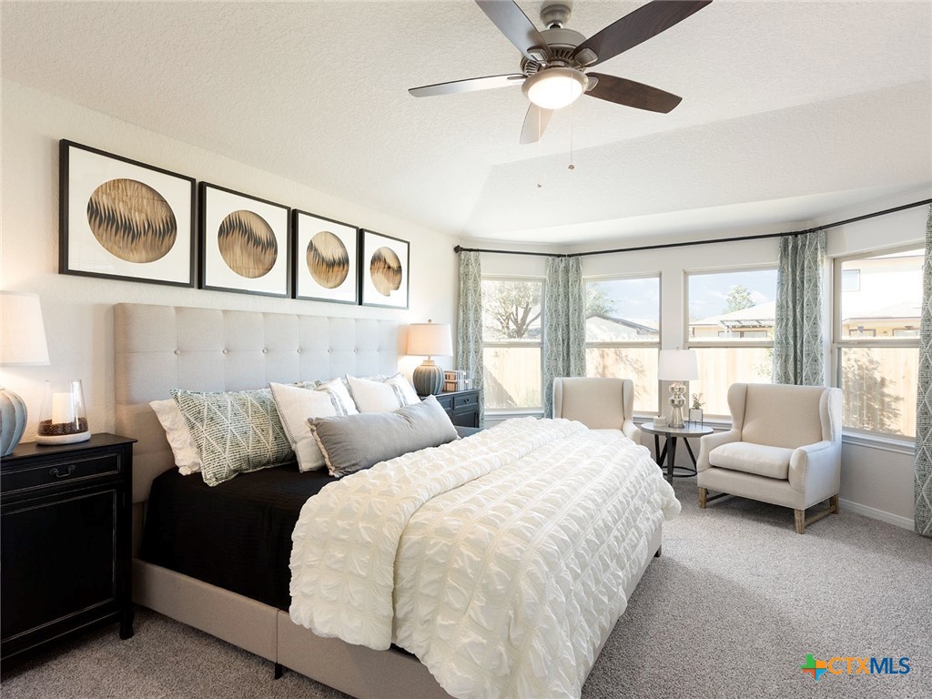 125 Dakota Ridge Cibolo, TX 78108 - Photo 7 of 13 a bedroom with a bed couch and window