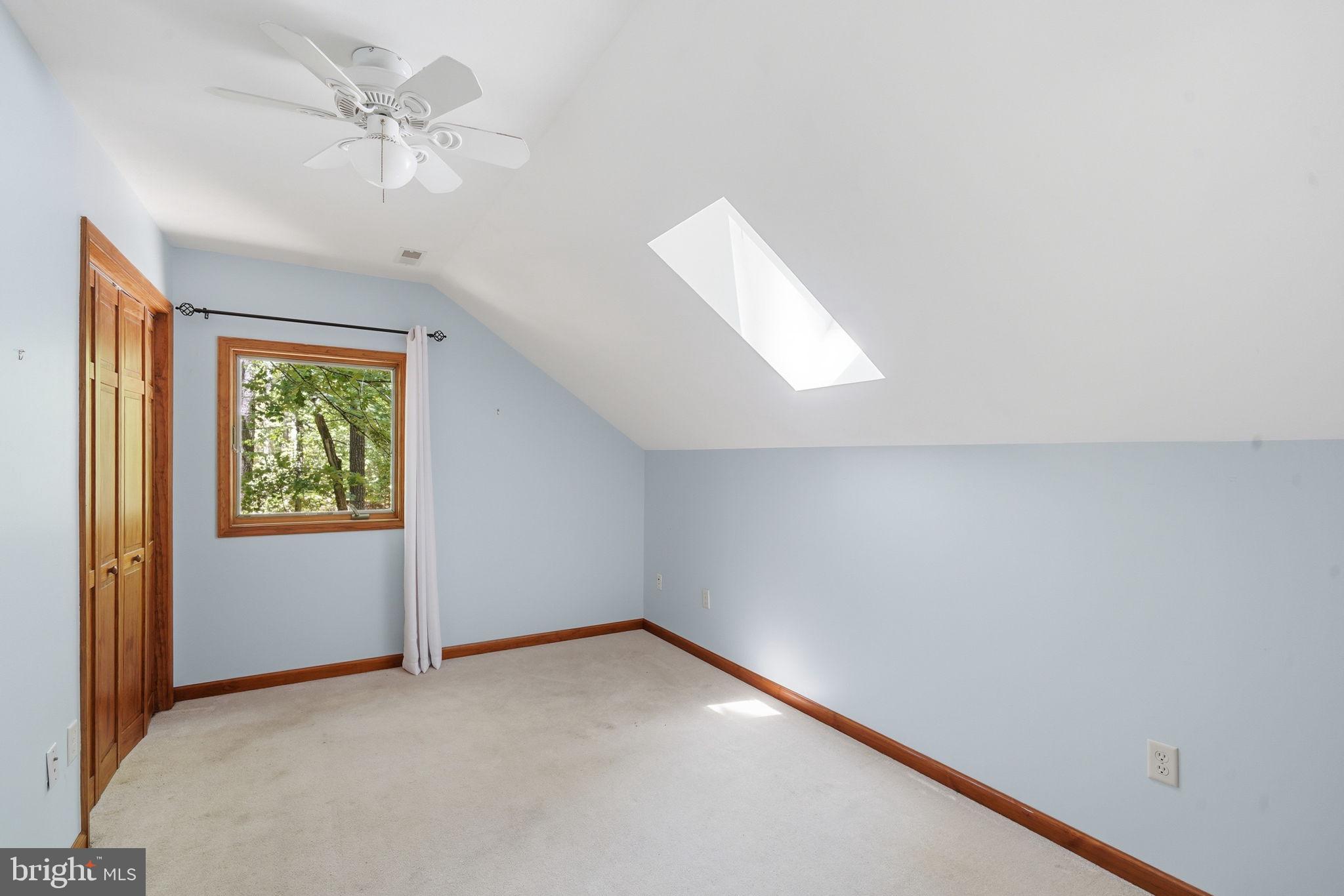22300 Frazier Road Rock Hall, MD 21661 - Photo 22 of 38 an empty room with windows and fan
