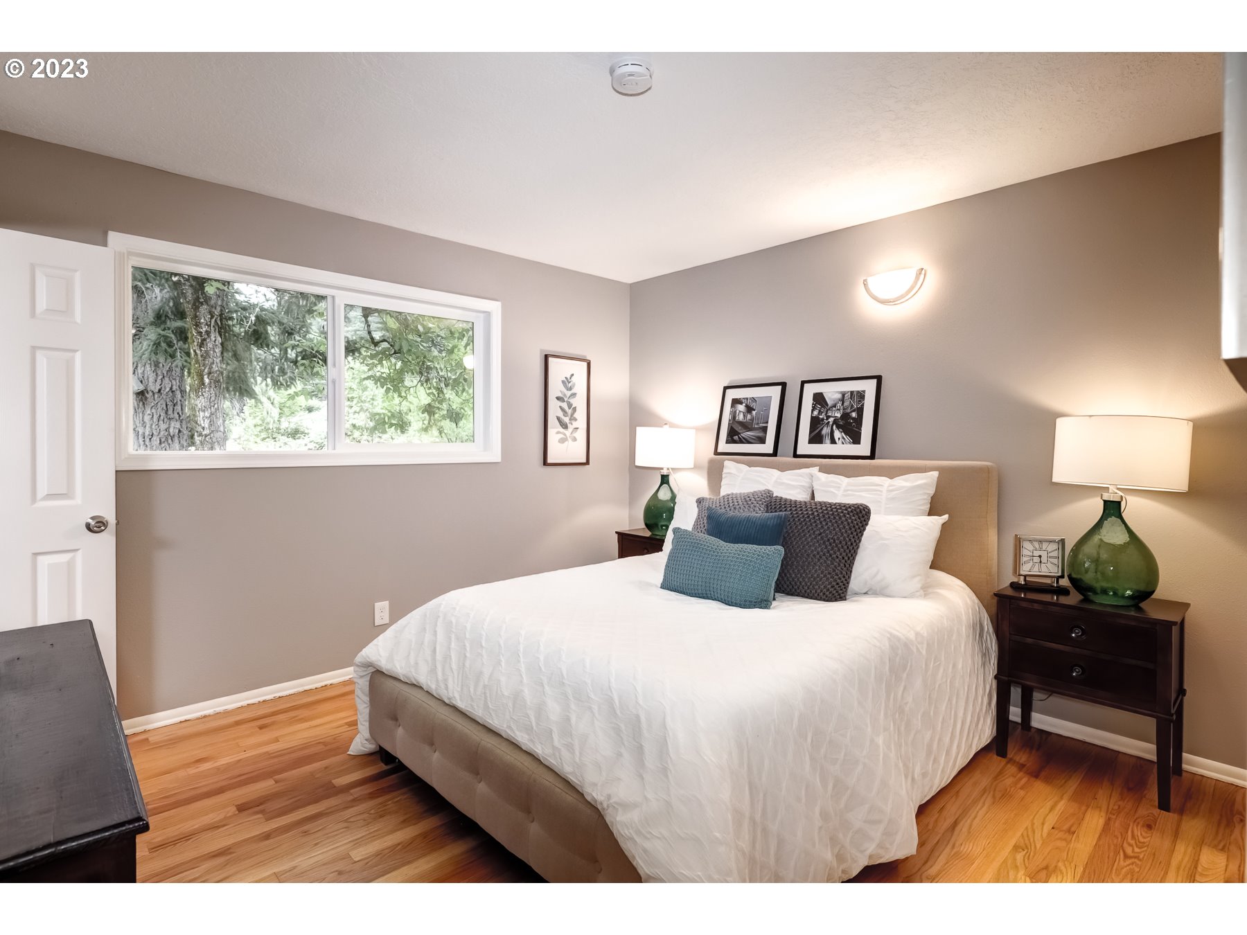 2540 Southeast 190th Avenue Gresham, OR 97030 - Photo 13 of 27 a bedroom with a bed and a lamp on table