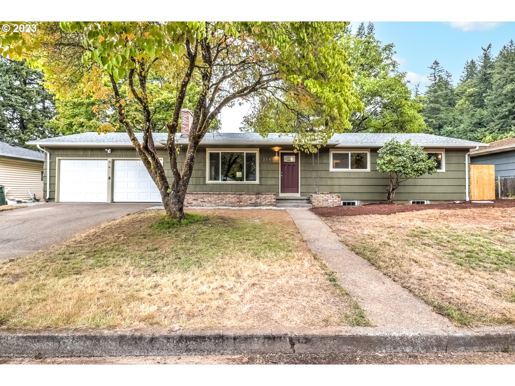 2540 Southeast 190th Avenue Gresham, OR 97030 - Photo 2 of 27 a backyard of a house with yard and outdoor seating