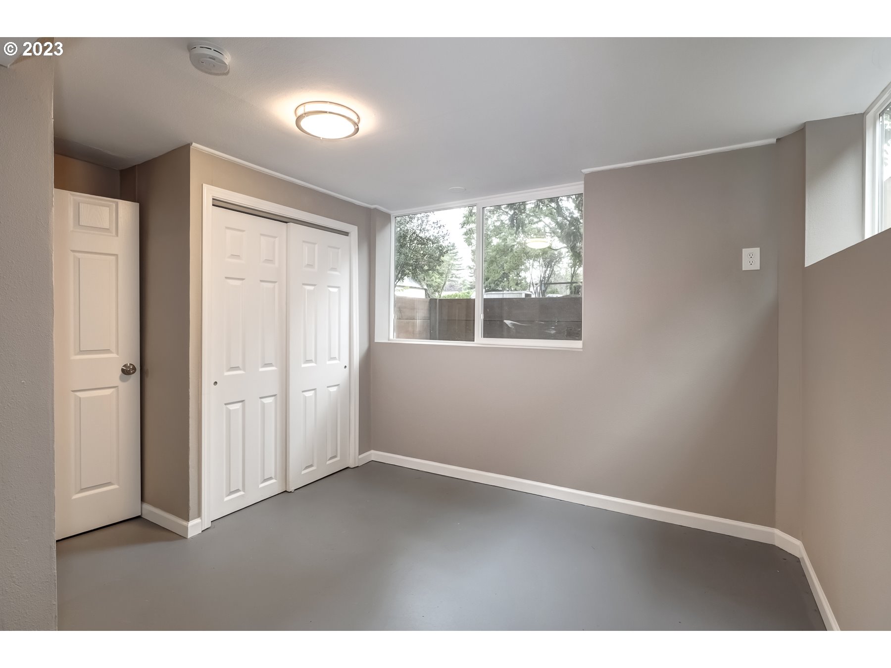 2540 Southeast 190th Avenue Gresham, OR 97030 - Photo 22 of 27 a view of an empty room with wooden floor and windows