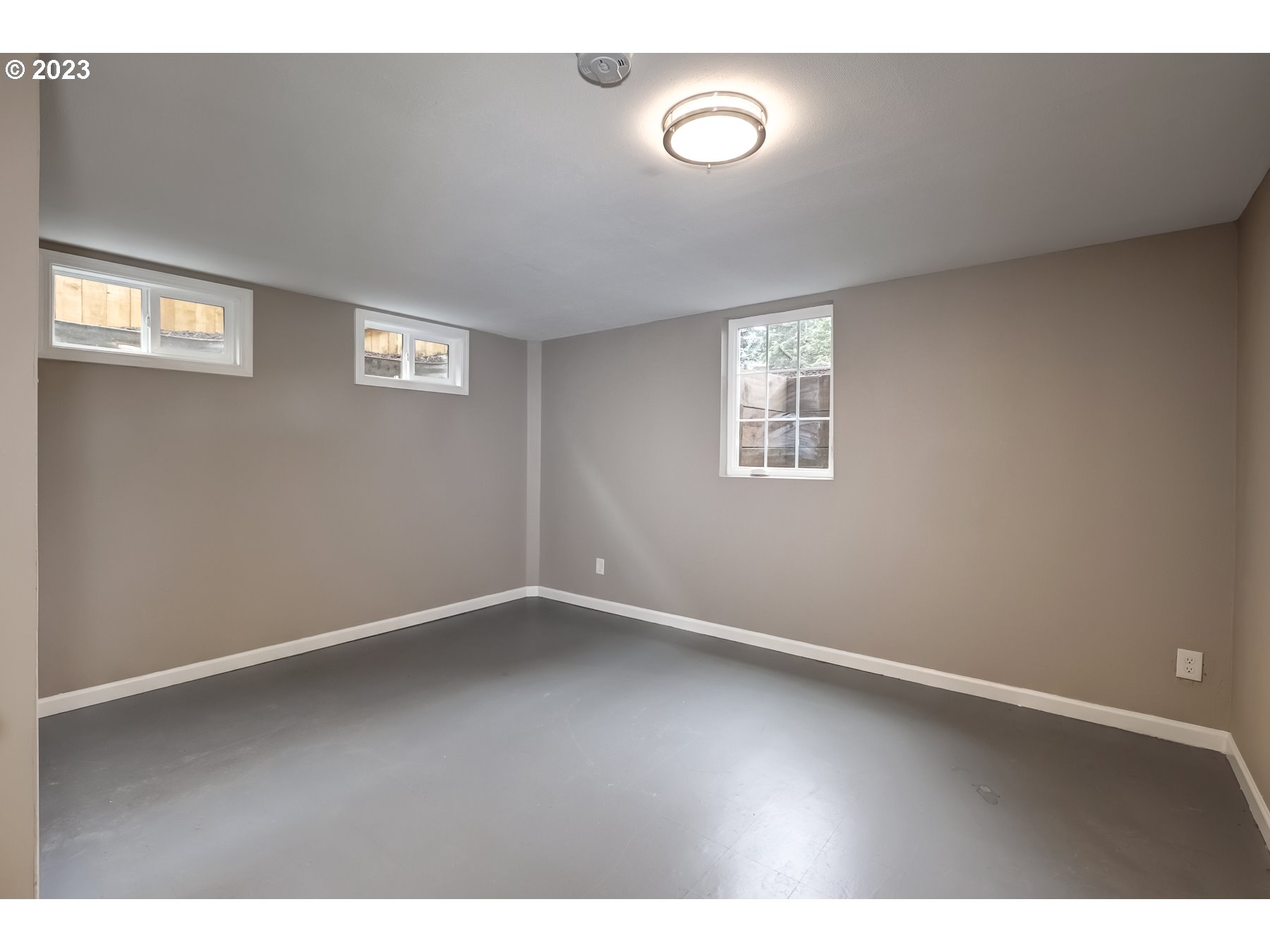 2540 Southeast 190th Avenue Gresham, OR 97030 - Photo 23 of 27 an empty room with wooden floor and windows
