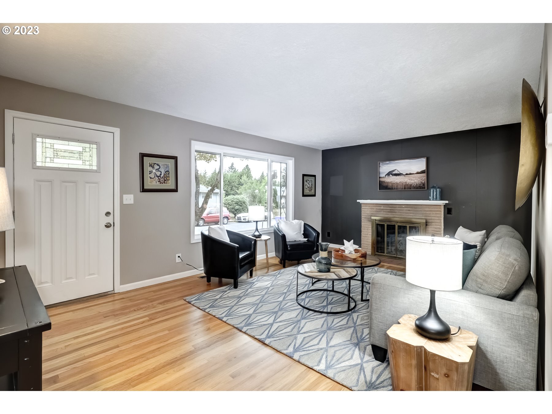 2540 Southeast 190th Avenue Gresham, OR 97030 - Photo 7 of 27 a living room with furniture a fireplace and a large window