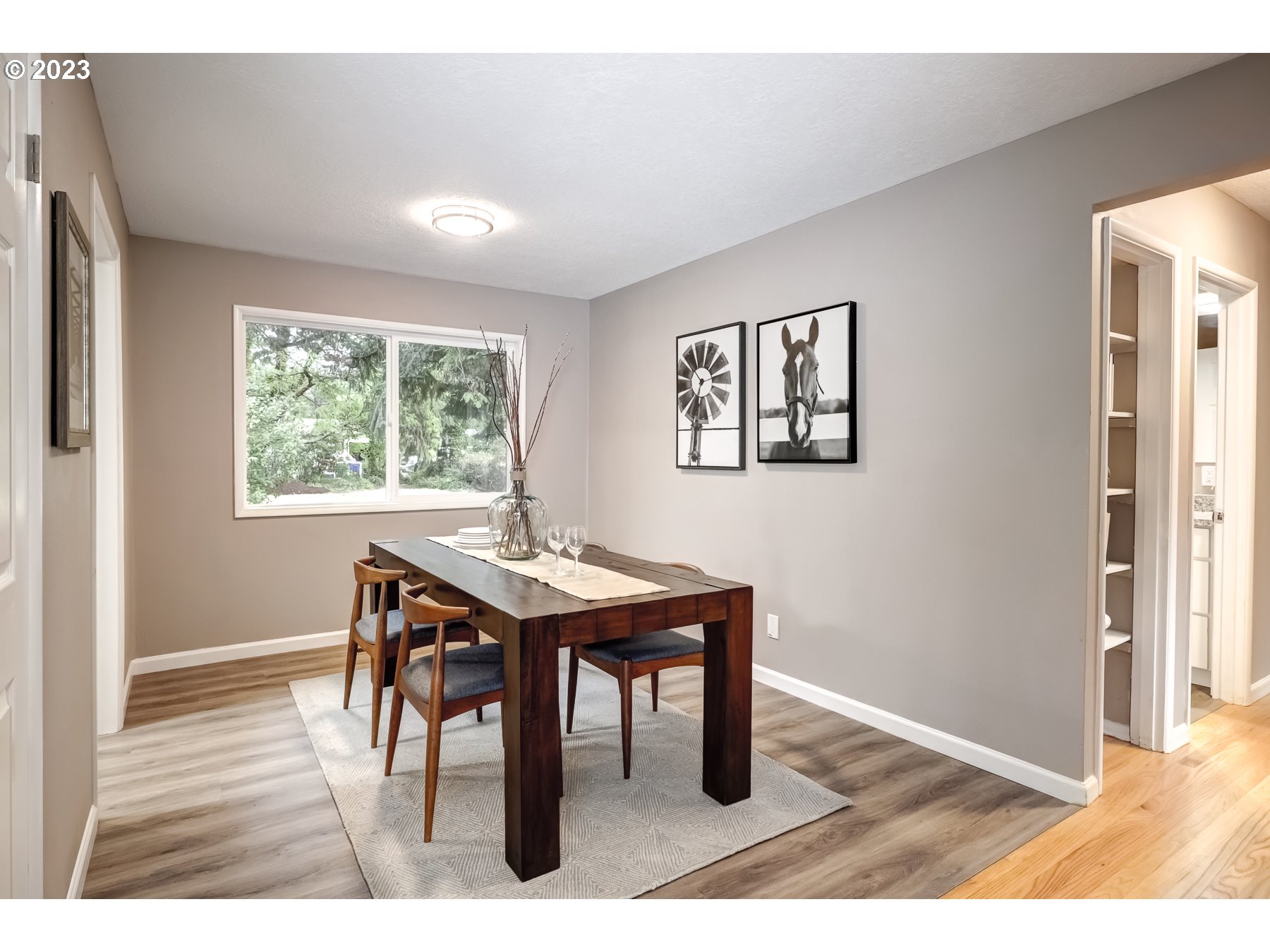 2540 Southeast 190th Avenue Gresham, OR 97030 - Photo 8 of 27 a view of a dining room with furniture and wooden floor