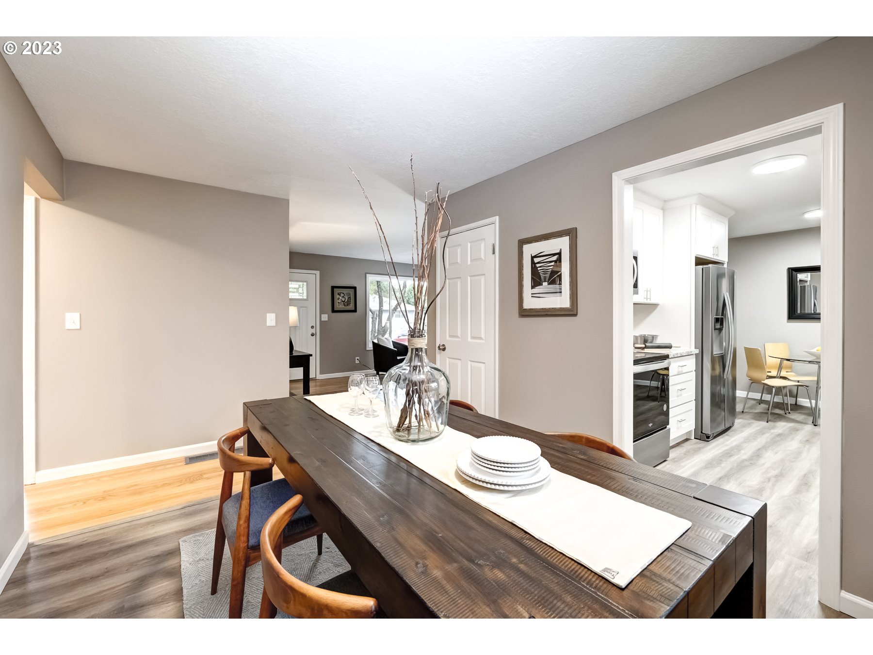 2540 Southeast 190th Avenue Gresham, OR 97030 - Photo 9 of 27 a room with a table chairs and wooden floor