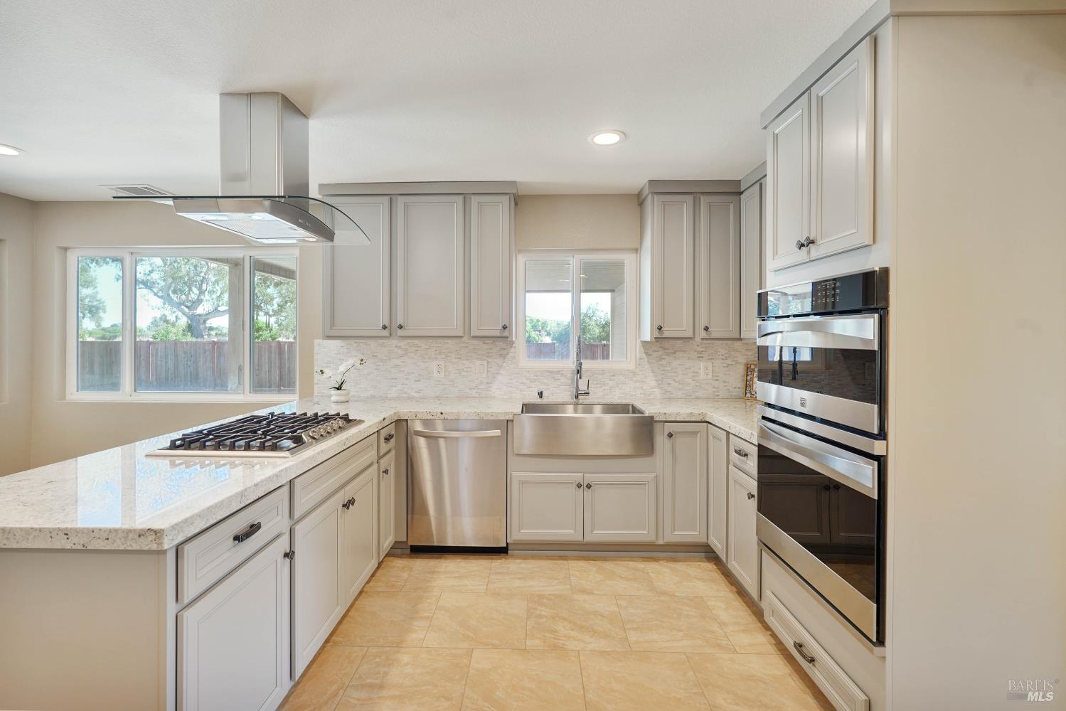 7208 Browns Valley Road Vacaville, CA 95688 - Photo 11 of 64 a kitchen with white cabinets and appliances