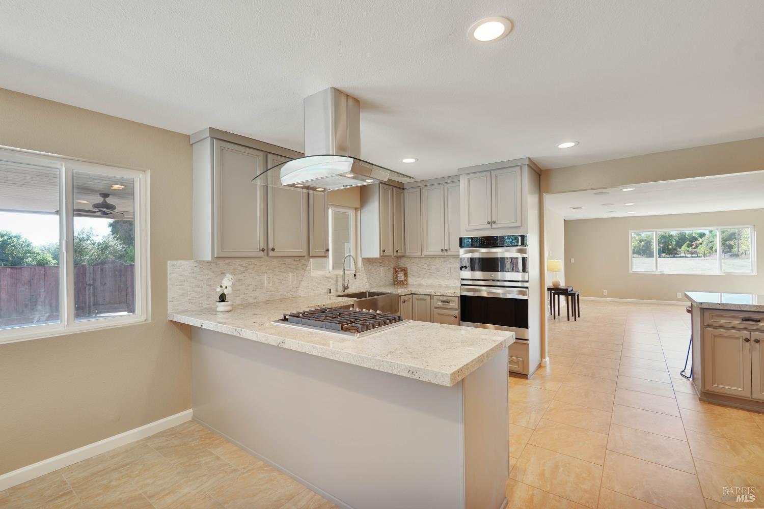 7208 Browns Valley Road Vacaville, CA 95688 - Photo 13 of 64 a kitchen with a stove a sink and a refrigerator