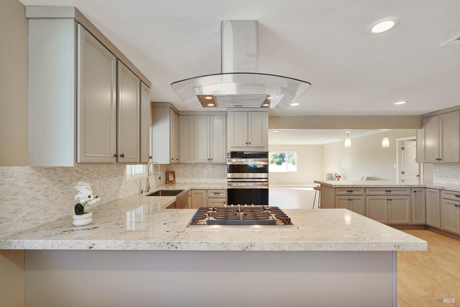 7208 Browns Valley Road Vacaville, CA 95688 - Photo 15 of 64 a large kitchen with kitchen island a sink stainless steel appliances and cabinets